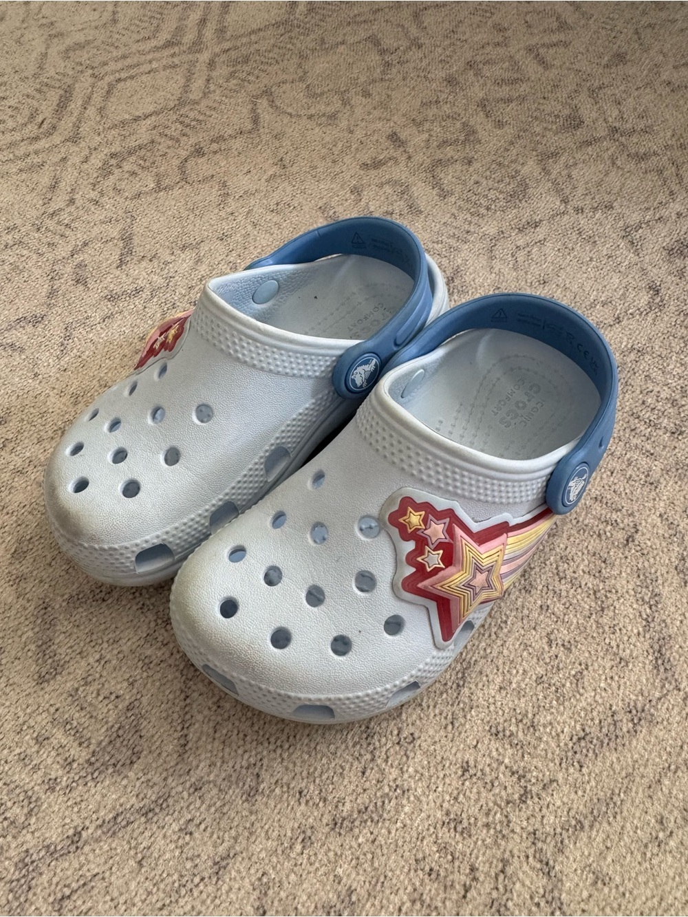 CROCS Kids White and Light Blue Clogs with light up Star Burst Charm